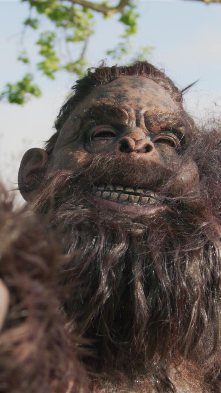 Bigfoot smiling blissfully in a park